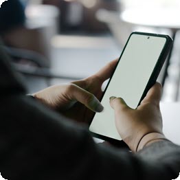 A person using a Smartphone with two
thumbs.